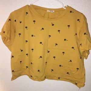 A yellow palm tree crop top